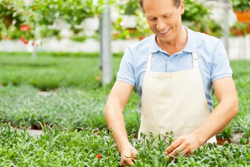 Team wearing PPE while performing garden maintenance tasks