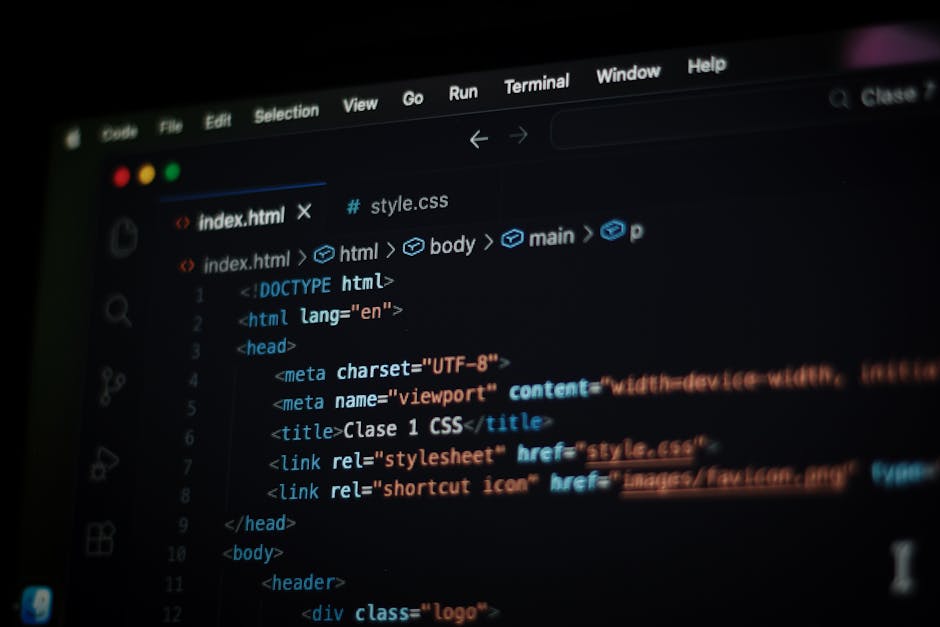 A close-up view of a computer screen displaying HTML code in a dark-themed code editor. The code includes tags such as <html>, <head>, <meta>, and <title>, with syntax highlighting in various colors l